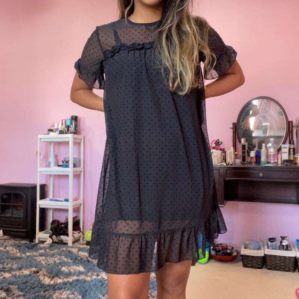 Black flowy polka dot mesh dress with black slip dress underneath